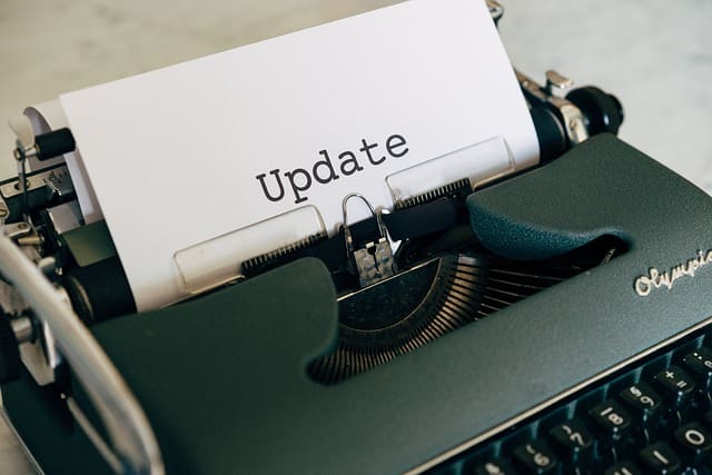 Close-up of a typewriter with the word 'Update' on a sheet of paper, symbolising the importance of regularly updating legal documents such as wills and estate plans.